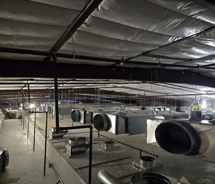 Spiral duct runs installed across a commercial ceiling