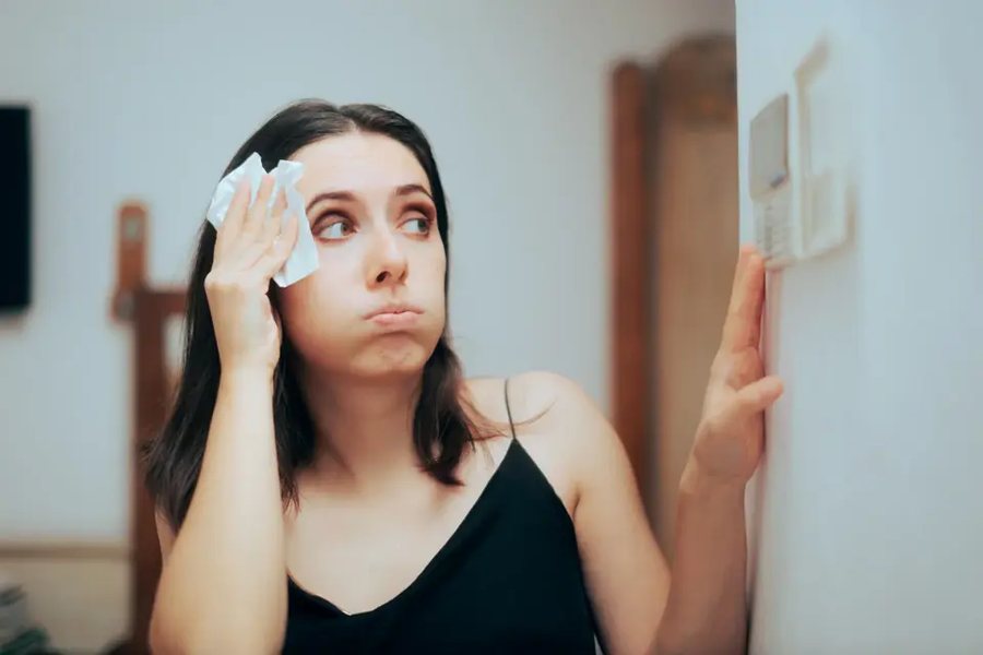 Homeowner uncomfortable in a hot house with a failed air conditioner